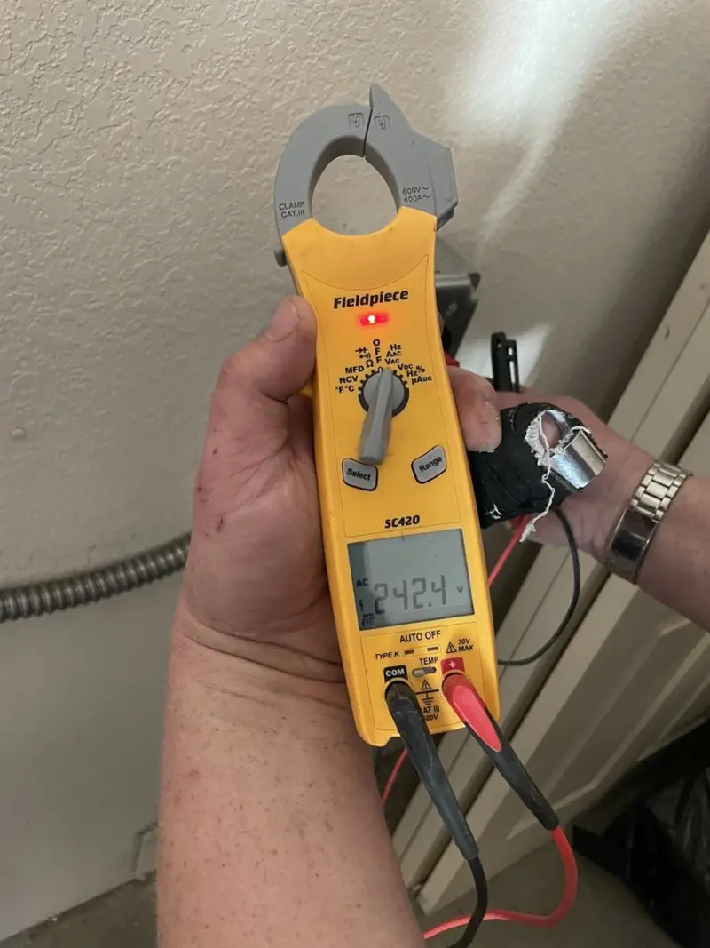 Voltage testing with clamp meter during Hot Tub / Pool Electrical Wiring in Blanding